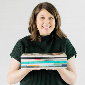 Bonnie Marlowe woman holdng stack of Bible studies against a white background